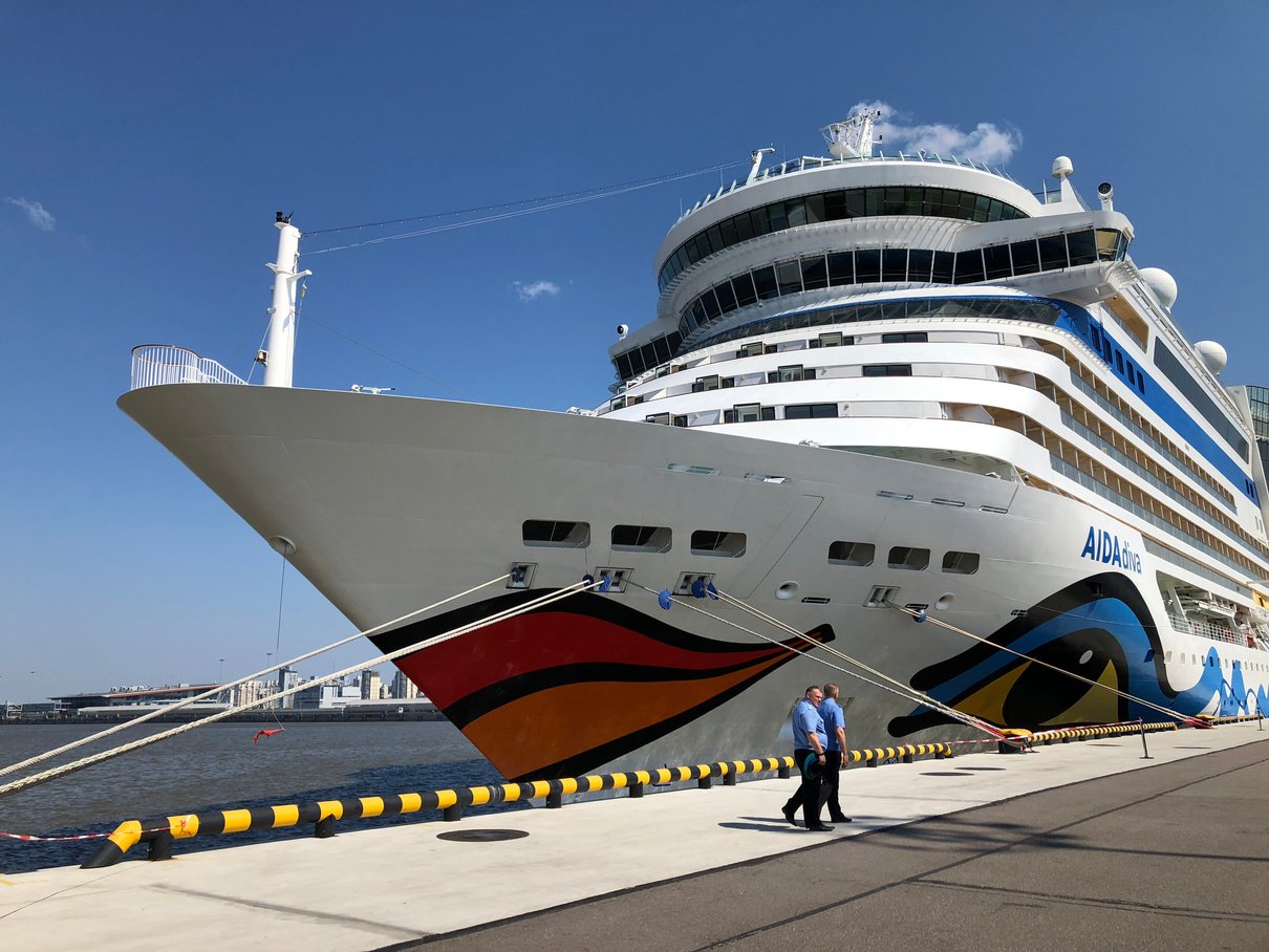 Men in Blue Uniform Near a Cruise Ship